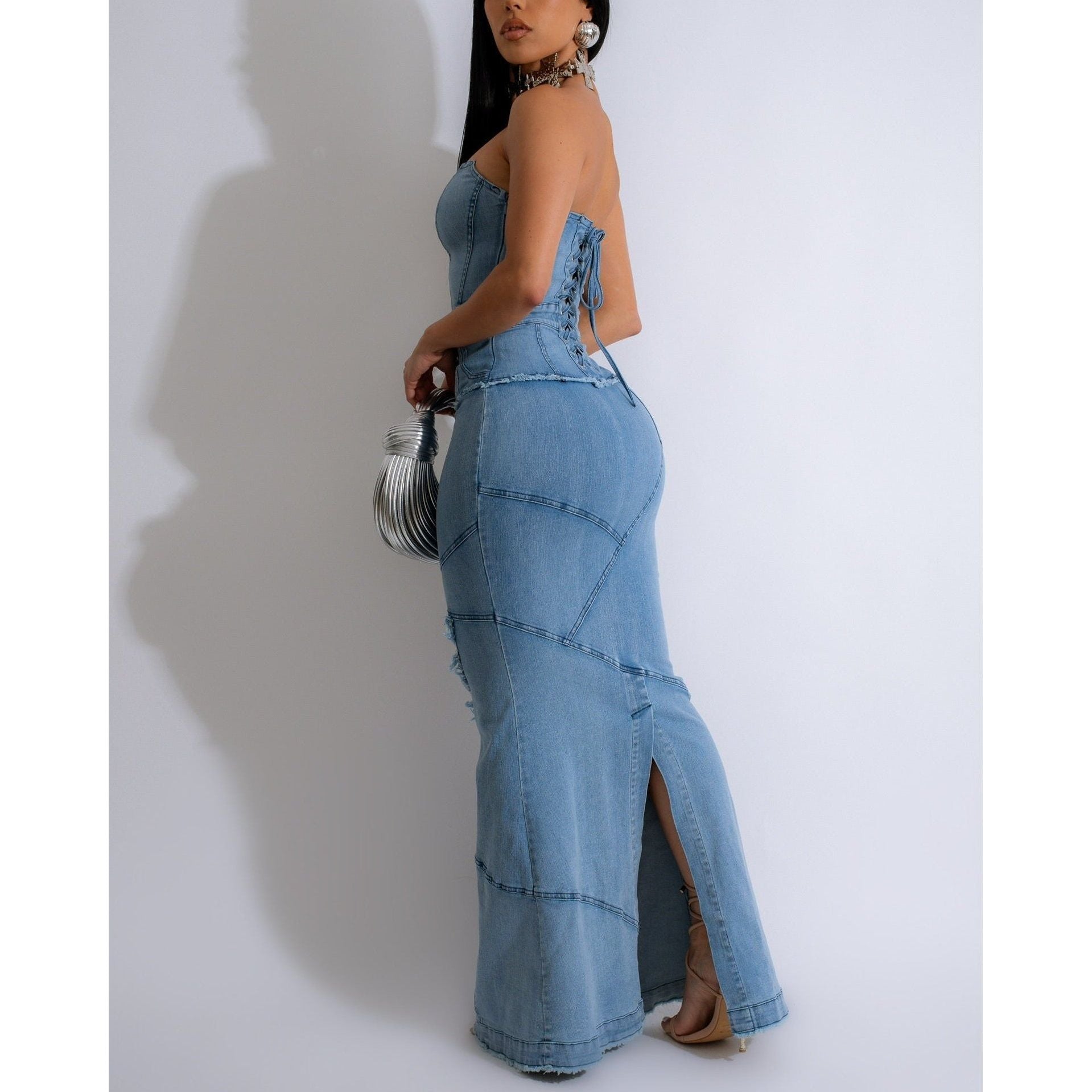 Strapless mermaid style denim maxi dress with distressed hem , corset lace up back details and rear slit 