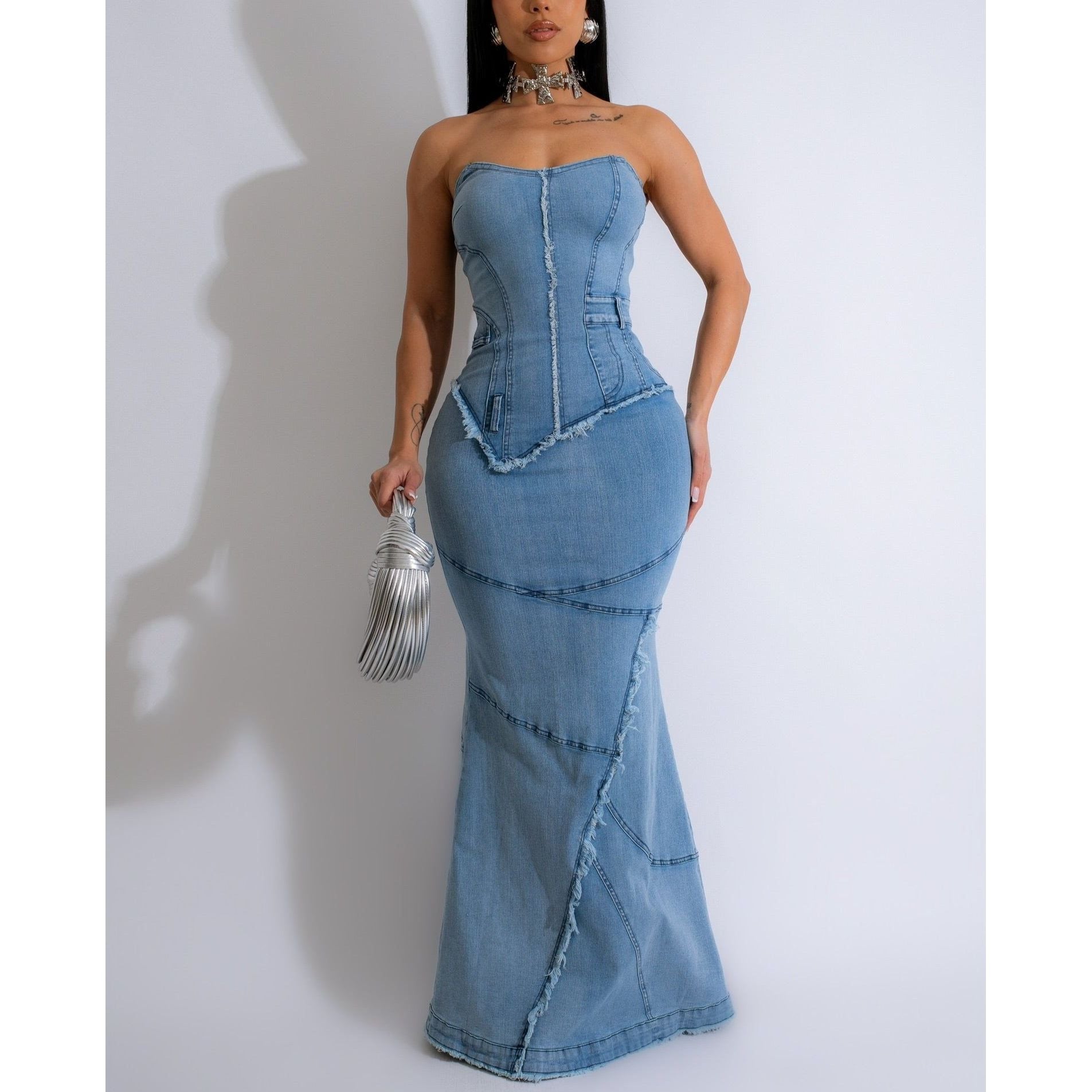 Strapless mermaid style denim maxi dress with distressed hem , corset lace up back details and rear slit 